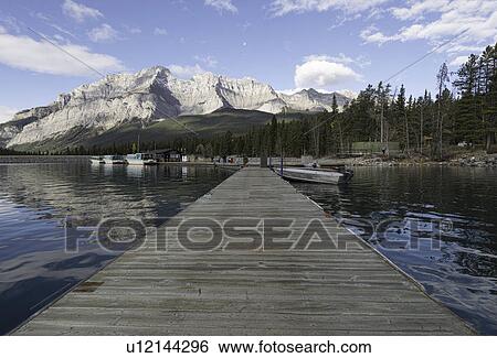 Pier on Lake Minnewanka View Large Photo Image Stock Photograph - Pier on Lake Minnewanka. Fotosearch
