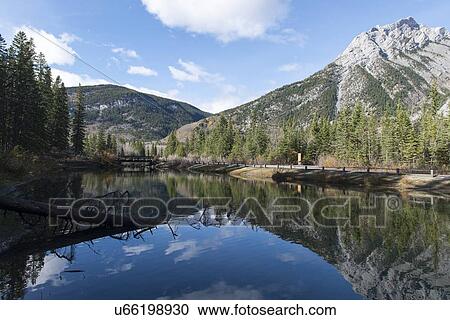 Stock Image - Reflections of High Meadow in Kananaskis Country, Rocky Mountains. Fotosearch