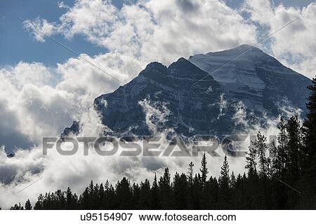 Ten Peaks surrounded by clouds View Large Photo Image Stock Photo - Ten Peaks surrounded by clouds. Fotosearch