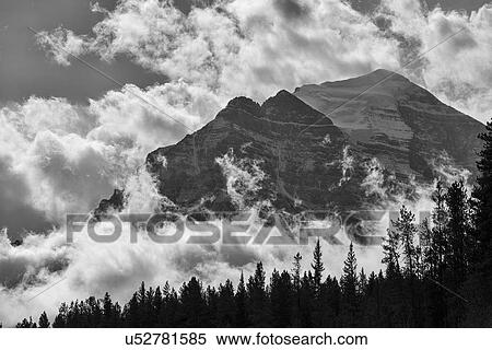 Stock Photography - Ten Peaks surrounded by clouds. Fotosearch