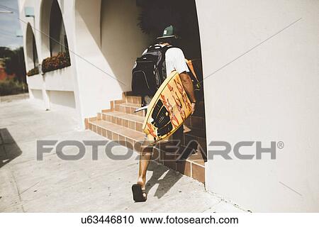 Australian surfer entering building View Large Photo Image Stock Image - Australian surfer entering building. Fotosearch