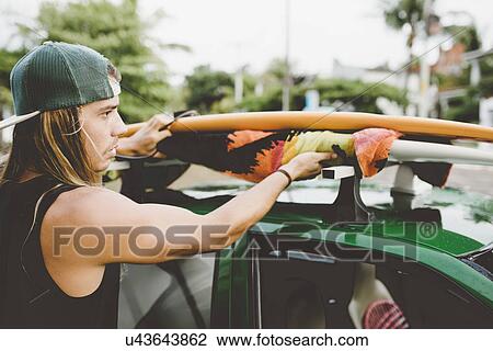 Australian surfer preparing for trip View Large Photo Image Stock Image - Australian surfer preparing for trip. Fotosearch