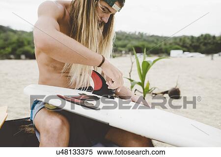 Australian surfer preparing surfboard, Bacocho, Puerto Escondido, Mexico View Large Photo Image Stock Photography - Australian surfer preparing surfboard, Bacocho, Puerto Escondido, Mexico. Fotosearch