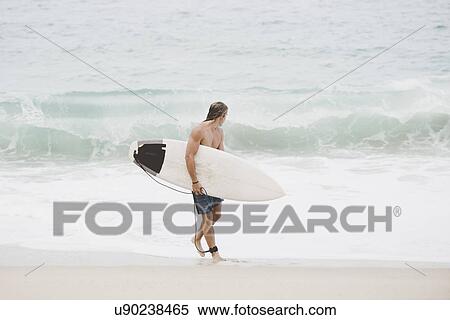 Australian surfer with surfboard on beach View Large Photo Image Stock Photography - Australian surfer with surfboard on beach. Fotosearch