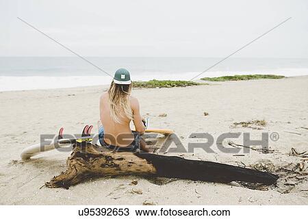 Stock Image - Australian surfer with surfboard, Bacocho, Puerto Escondido, Mexico. Fotosearch