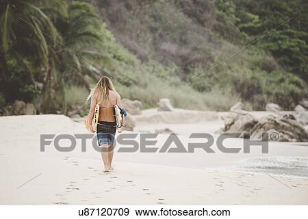 Stock Photo - Australian surfer with surfboard, Bacocho, Puerto Escondido, Mexico. Fotosearch