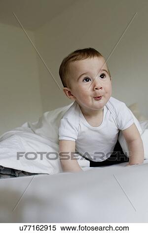 Baby boy making facial expressions View Large Photo Image Stock Photography - Baby boy making facial expressions. Fotosearch