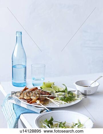 Stock Photography - BBQ Prawns, lime and mint dish. Fotosearch