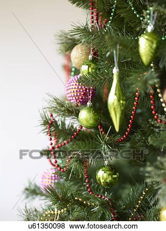 Close up of christmas tree with baubles View Large Photo Image Stock Photo - Close up of christmas tree with baubles. Fotosearch