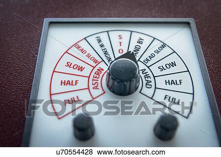 Stock Photo - Close up of engine speed controls on container ship. Fotosearch