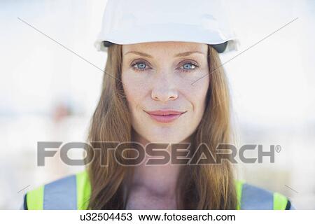 Close up portrait of female site manager on construction site View Large Photo Image Stock Image - Close up portrait of female site manager on construction site. Fotosearch