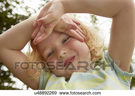 Close up portrait of girl with hands on face View Large Photo Image Stock Photo - Close up portrait of girl with hands on face. Fotosearch