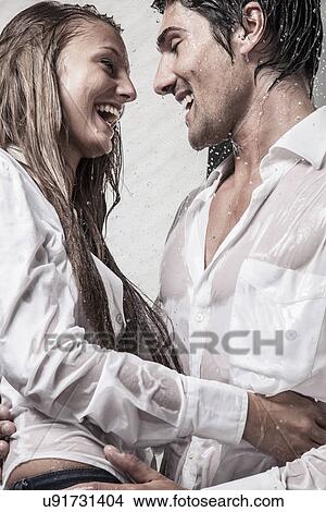 Couple taking shower dressed View Large Photo Image Picture - Couple taking shower dressed. Fotosearch