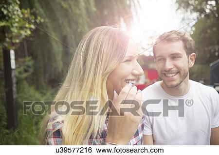 Stock Photograph - Couple walking along canal. Fotosearch