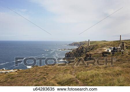 Distant view of tin mine ruins on coastal path, Trewellard, Penzance, Cornwall, UK View Large Photo Image Stock Photography - Distant view of tin mine ruins on coastal path, Trewellard, Penzance, Cornwall, UK. Fotosearch