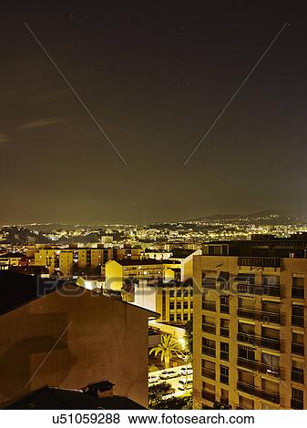 Stock Photo - Elevated view of city at night, Nice, France. Fotosearch
