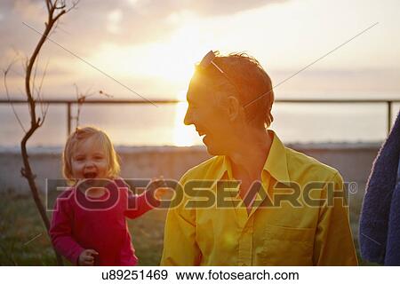 Stock Photo - Father and daughter laughing. Fotosearch