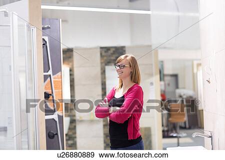 Stock Photo - Female customer admiring display in hardware store. Fotosearch