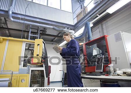 Female engineer monitoring factory machinery using digital tablet View Large Photo Image Stock Photo - Female engineer monitoring factory machinery using digital tablet. Fotosearch