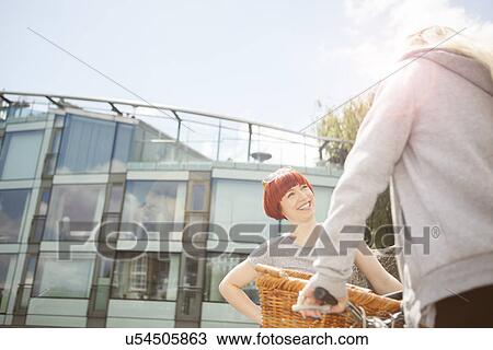 Friends chatting, glass-fronted building in background View Large Photo Image Stock Image - Friends chatting, glass-fronted building in background. Fotosearch