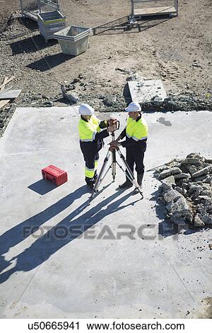 High angle view of site manager and surveyor on construction site View Large Photo Image Stock Image - High angle view of site manager and surveyor on construction site. Fotosearch