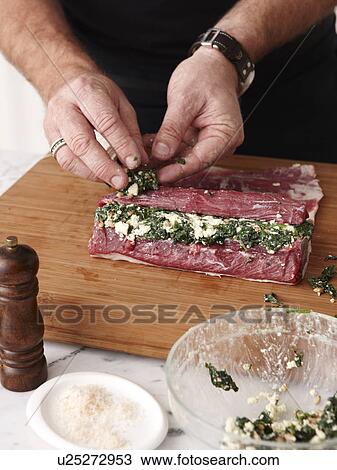 Stock Image - How to make Rolled Rare Lamb Ratatouille Step 06. Fotosearch