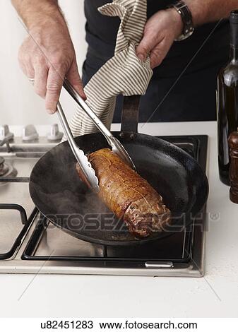 Stock Image - How to make Rolled Rare Lamb Ratatouille Step 08. Fotosearch