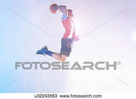 Male basketball player throwing ball View Large Photo Image Stock Image - Male basketball player throwing ball. Fotosearch