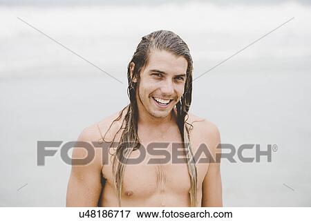 Stock Photo - Man in long hair with wide smile. Fotosearch