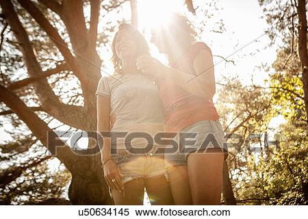 Mother and daughter enjoying nature in forest View Large Photo Image Stock Photography - Mother and daughter enjoying nature in forest. Fotosearch