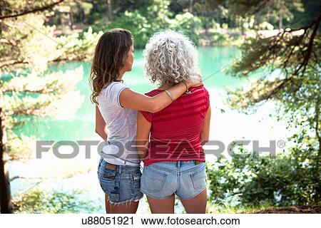 Stock Image - Mother and daughter enjoying nature, The Blue Pool, Wareham, Dorset, United Kingdom. Fotosearch