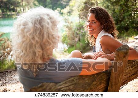 Stock Photo - Mother and daughter enjoying nature, The Blue Pool, Wareham, Dorset, United Kingdom. Fotosearch