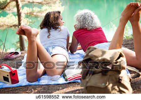 Mother and daughter on picnic blanket by the Blue Pool, Wareham, Dorset, United Kingdom View Large Photo Image Stock Image - Mother and daughter on picnic blanket by the Blue Pool, Wareham, Dorset, United Kingdom. Fotosearch