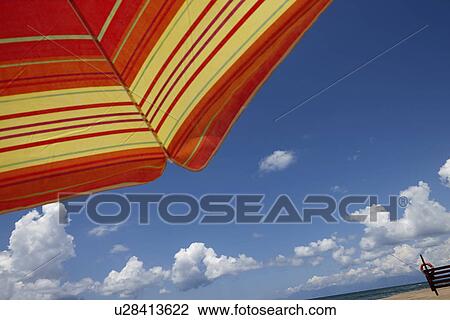 Parasol against blue sky, low angle View Large Photo Image Stock Image - Parasol against blue sky, low angle. Fotosearch