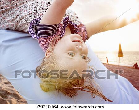 Person carrying young girl on back View Large Photo Image Picture - Person carrying young girl on back. Fotosearch
