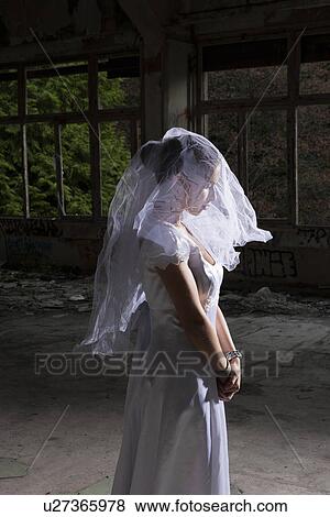 Portrait of bride in empty abandoned interior View Large Photo Image Stock Photo - Portrait of bride in empty abandoned interior. Fotosearch