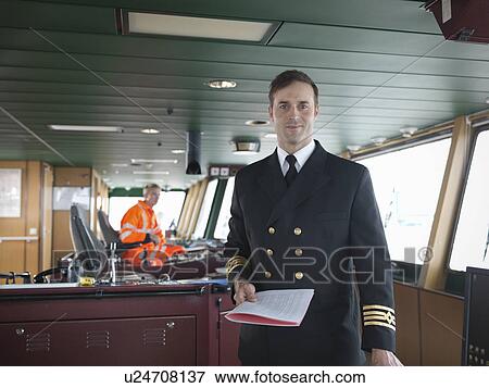 Portrait of captain on bridge of ship View Large Photo Image Stock Photo - Portrait of captain on bridge of ship. Fotosearch