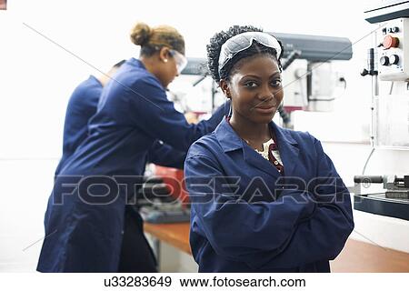 Portrait of female student in college metalwork workshop View Large Photo Image Stock Photo - Portrait of female student in college metalwork workshop. Fotosearch
