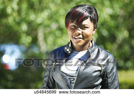 Portrait of female student outside college View Large Photo Image Stock Photo - Portrait of female student outside college. Fotosearch