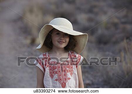 Portrait of girl in sunhat, Almeria, Andalusia, Spain View Large Photo Image Picture - Portrait of girl in sunhat, Almeria, Andalusia, Spain. Fotosearch
