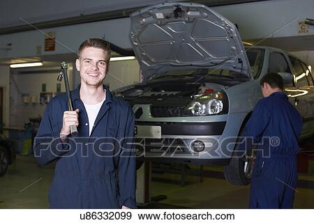 Portrait of male student mechanic in college garage View Large Photo Image Stock Photo - Portrait of male student mechanic in college garage. Fotosearch