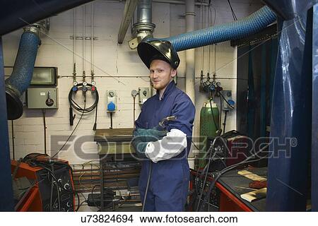 Portrait of male student welder in college workshop View Large Photo Image Picture - Portrait of male student welder in college workshop. Fotosearch