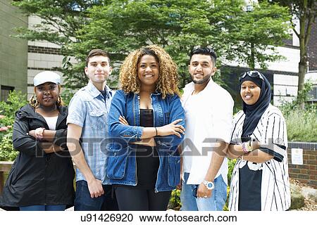 Stock Image - Portrait of student friends at college. Fotosearch