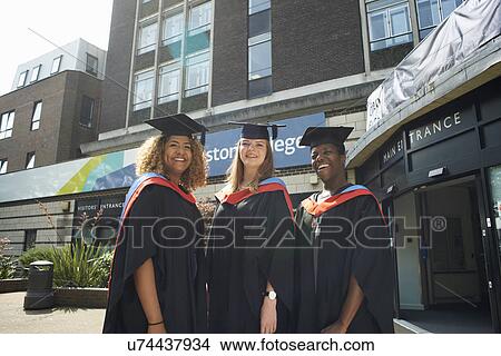 Portrait of three college students in graduation gowns and caps View Large Photo Image Picture - Portrait of three college students in graduation gowns and caps. Fotosearch