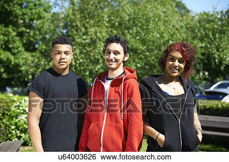 Portrait of three student friends outside college View Large Photo Image Stock Photograph - Portrait of three student friends outside college. Fotosearch