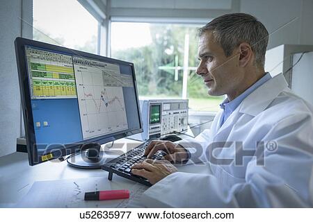Stock Photo - Scientist using computer to study electromagnetic interference results. Fotosearch