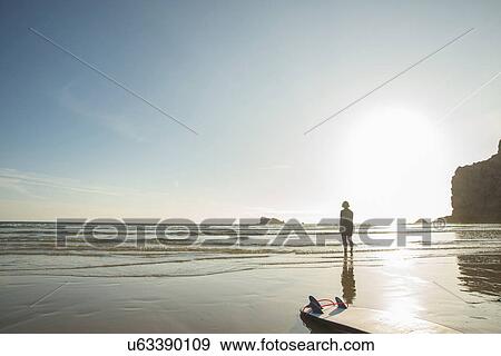 Senior woman surfer standing looking out to sea, Camaret-sur-mer, Brittany, France View Large Photo Image Stock Photo - Senior woman surfer standing looking out to sea, Camaret-sur-mer, Brittany, France. Fotosearch
