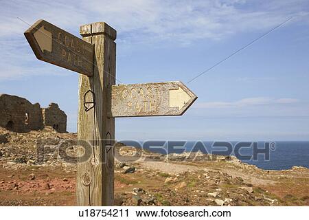 Sign post and tin mine ruins on coastal path, Trewellard, Penzance, Cornwall, UK View Large Photo Image Stock Image - Sign post and tin mine ruins on coastal path, Trewellard, Penzance, Cornwall, UK. Fotosearch