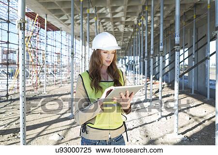 Site manager using touchscreen on digital tablet on construction site View Large Photo Image Stock Photography - Site manager using touchscreen on digital tablet on construction site. Fotosearch