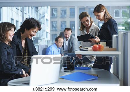 Six businesswomen and men working in busy office View Large Photo Image Stock Photo - Six businesswomen and men working in busy office. Fotosearch